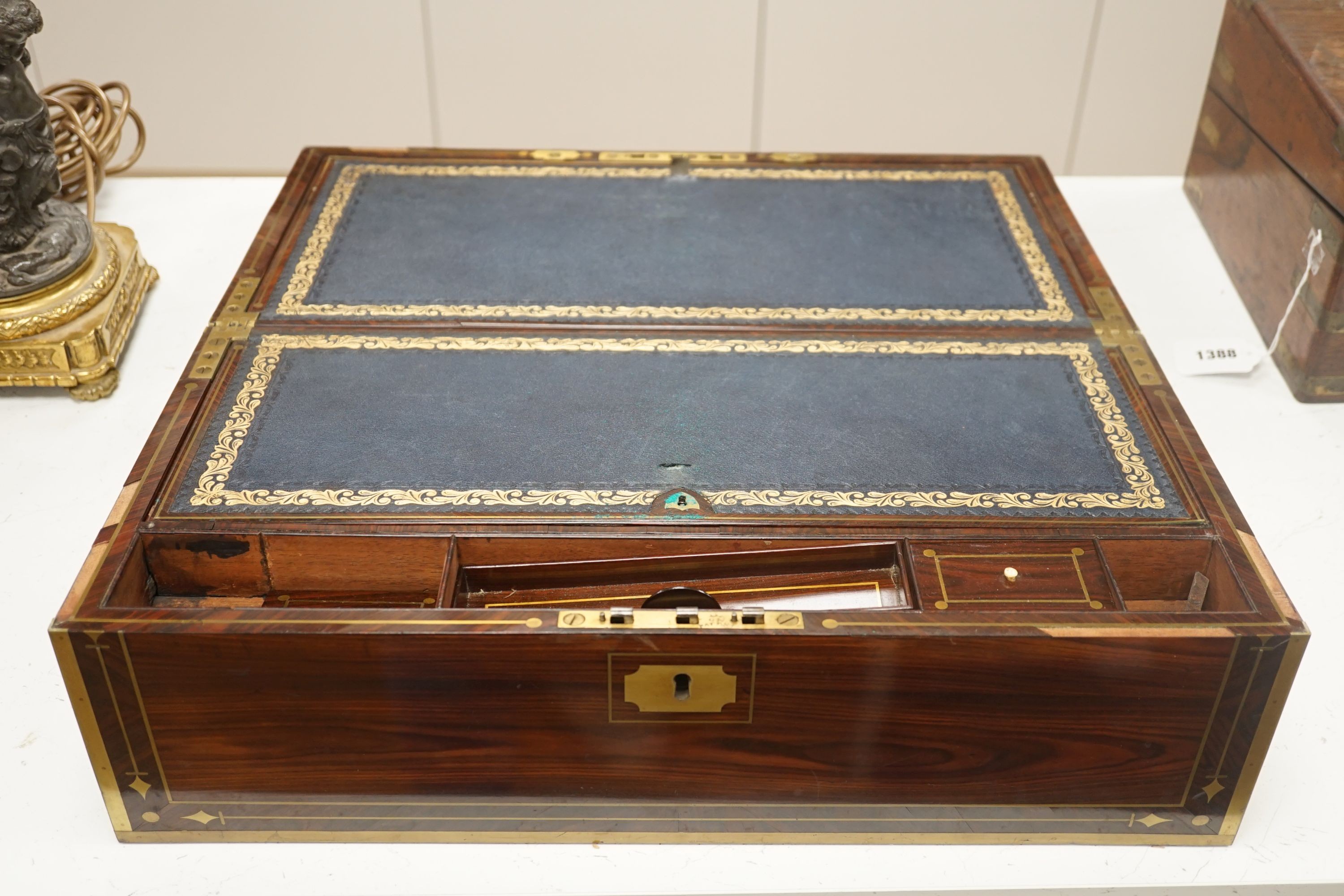 A George IV brass bound kingwood writing slope, 52cm